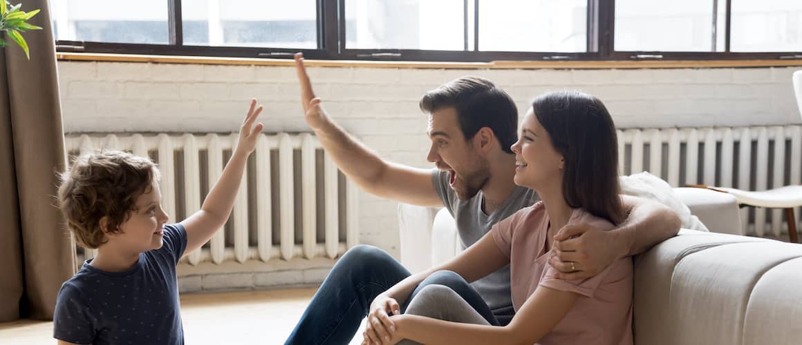 A young and a happy family in their new house.