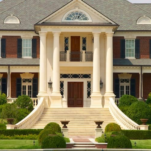 Rose Hill Estate, a 40 million dollar mansion in Georgia, with a grand staircase leading up to the front door.