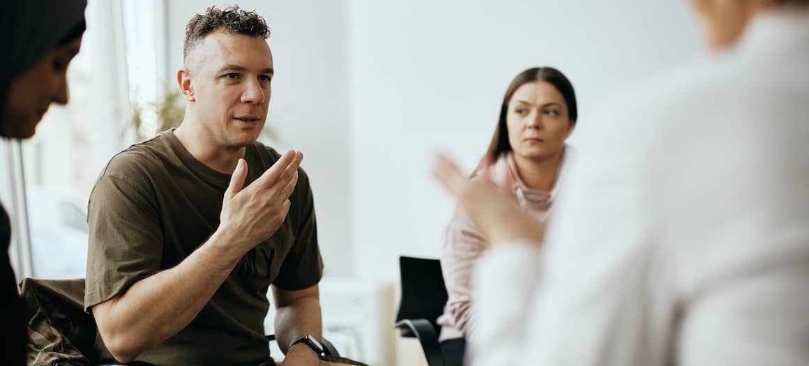 A military man speaking to an advisor, potentially discussing financial aspects or options related to housing.