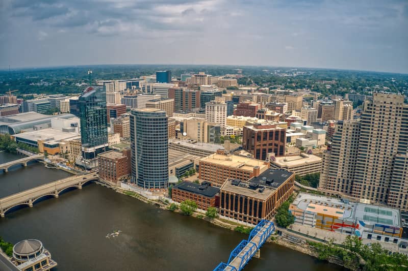 RHB Assets From IGX: A stunning aerial view of the Grand Rapids cityscape with a river running through the city.