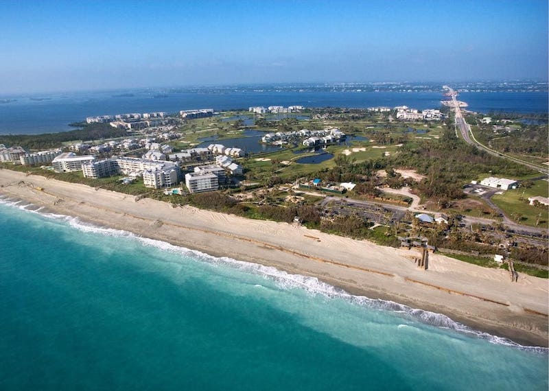 Aerial view of beachfront town.