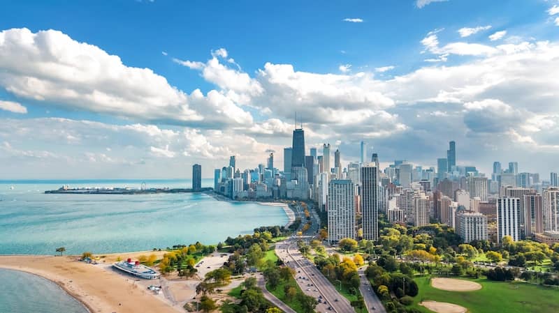 RHB Assets From IGX: Aerial view of downtown Chicago, Illinois with skyscrapers and waterfront.