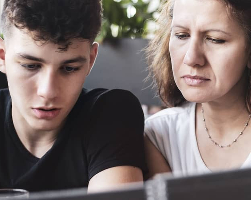Image of parent teaching her child about loans.
