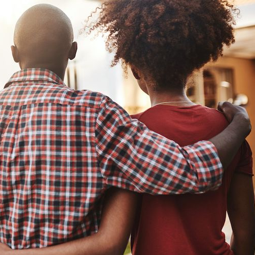 A couple in a backyard, potentially representing a couple spending time in a backyard setting.