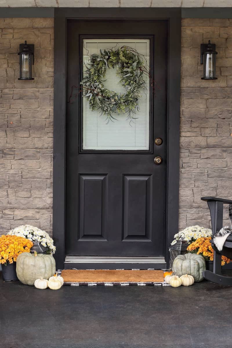 Grey front door with fall decor