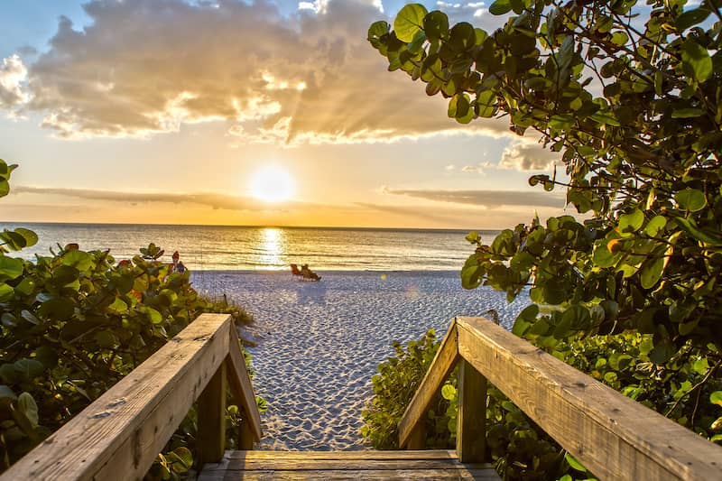 RHB Assets From IGX: People watching sunset on Naples Beach pier