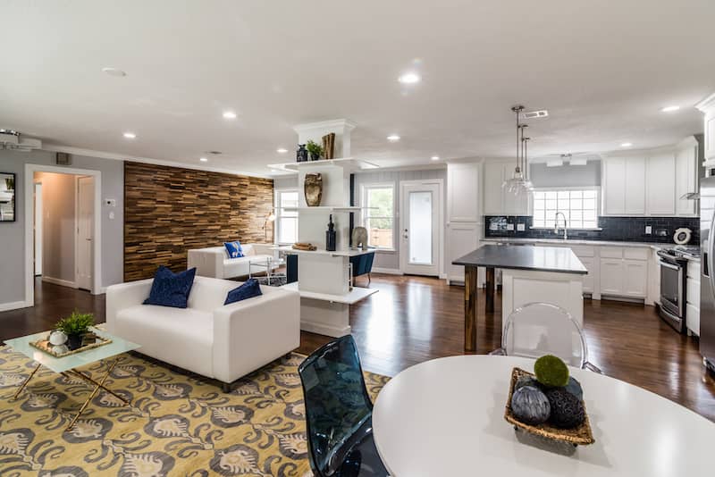 View of open floor plan kitchen, two living areas, and dining area.