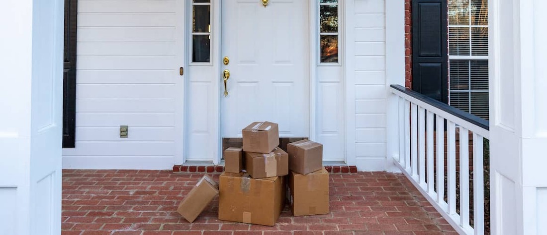 Pile of boxes on front porch.