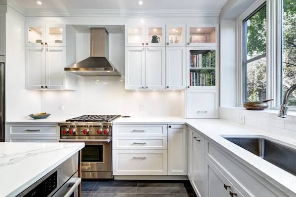 New modern kitchen with large windows over sink.