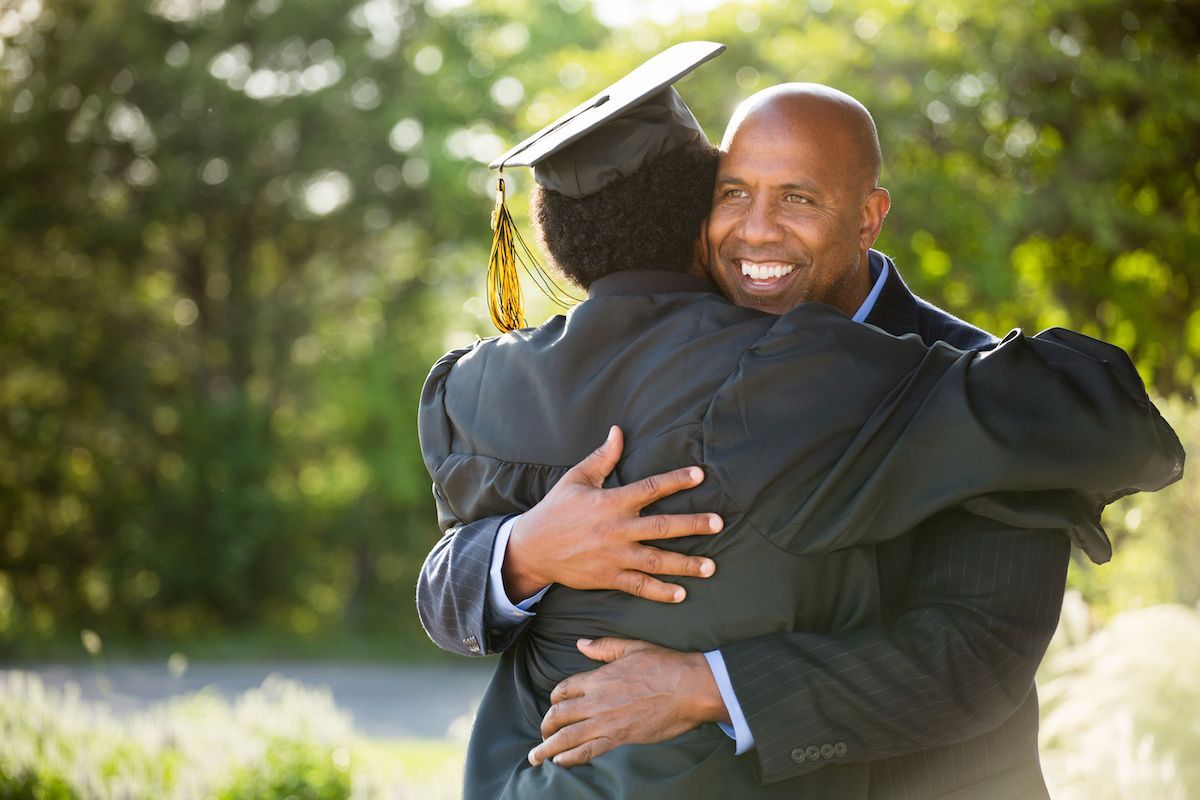 RHB Assets From IGX: African-American father and son at graduation ceremony