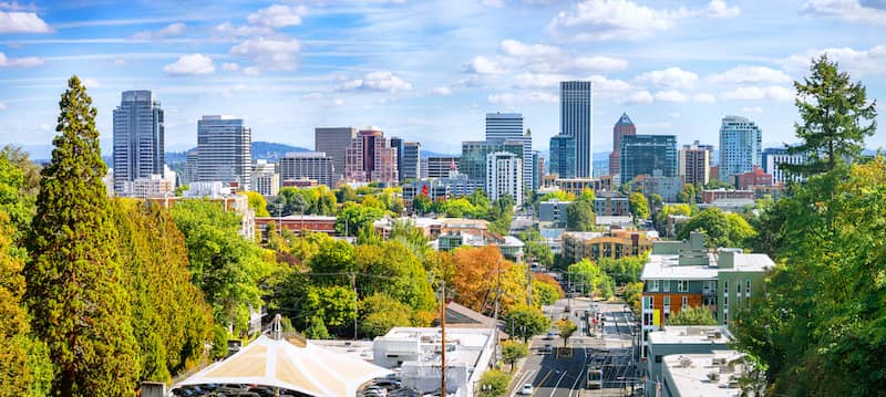 RHB Assets From IGX: A stunning view of Portland, Oregon, showcasing a bridge, river, and city skyline.