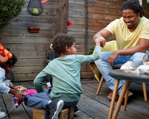 Family celebrating in backyard.