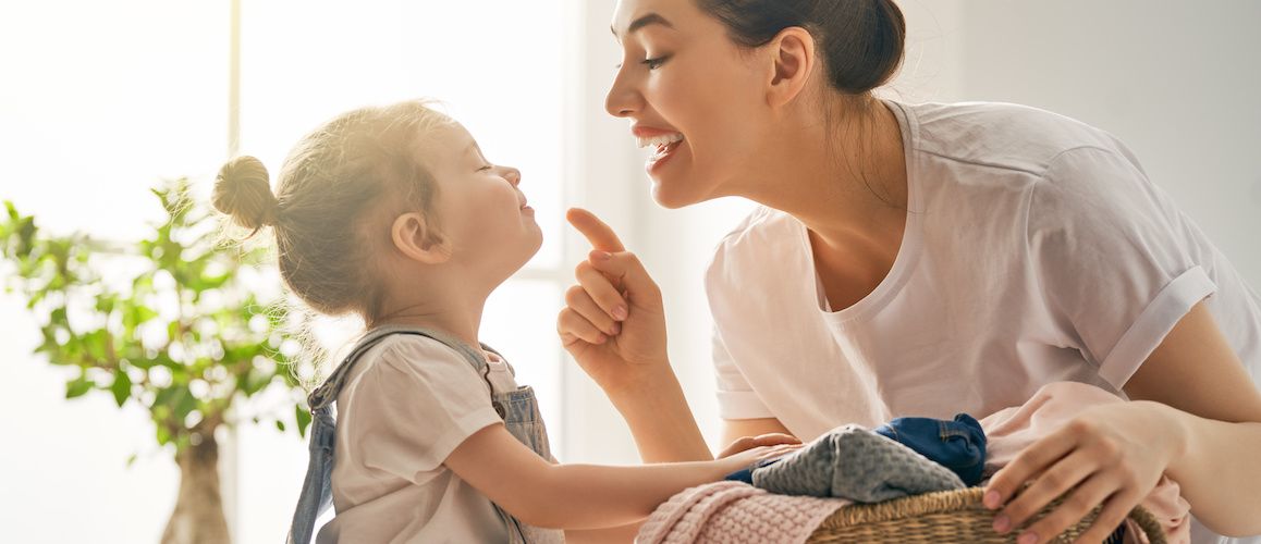 Image of a mom and daughter, potentially discussing or engaging in a real estate decision.