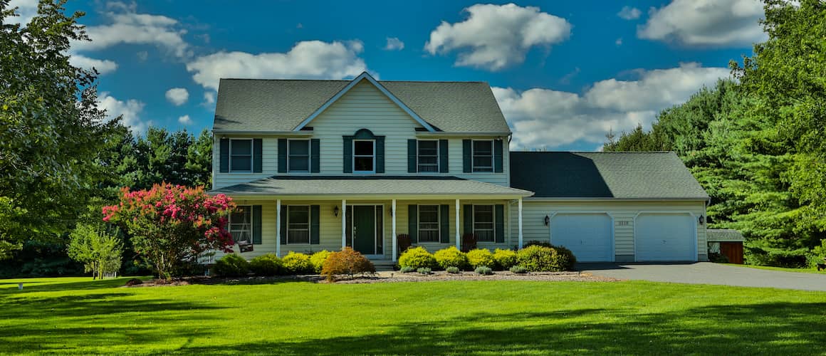 RHB Assets From IGX: Colonial home with a green lawn and white fence