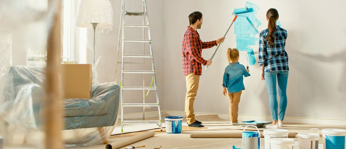 RHB Assets From IGX: Couple painting a wall during a home renovation project