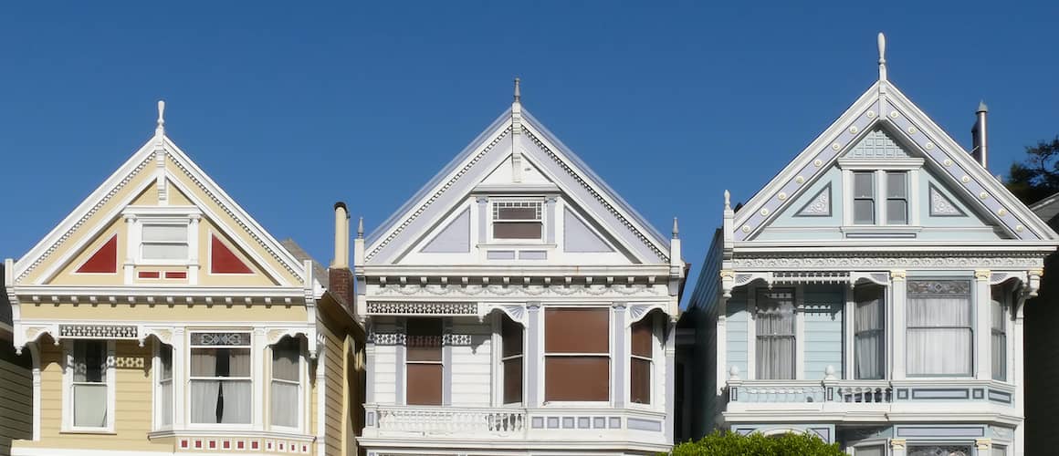 Three Victorian houses, possibly representing historic or classic home styles.