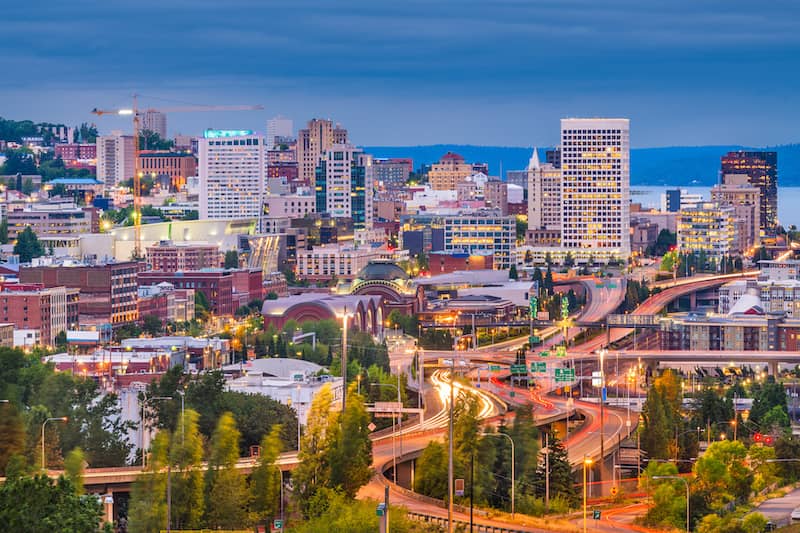 RHB Assets From IGX: Tacoma, Washington, skyline at sunset with a view of the waterfront.