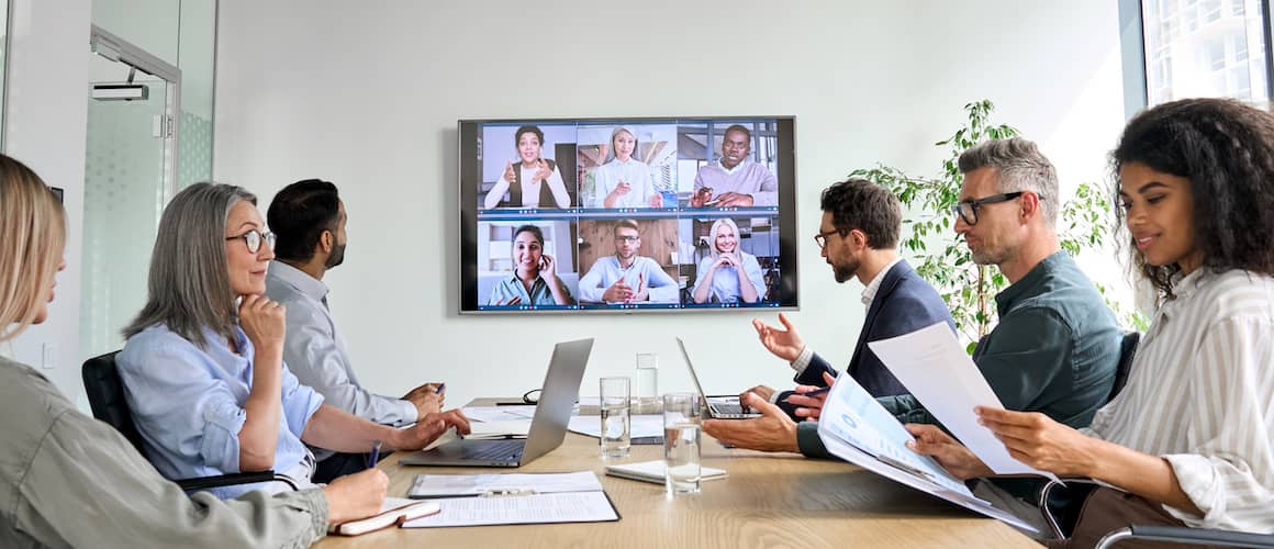 A group of real estate agents and customers having an online meeting.