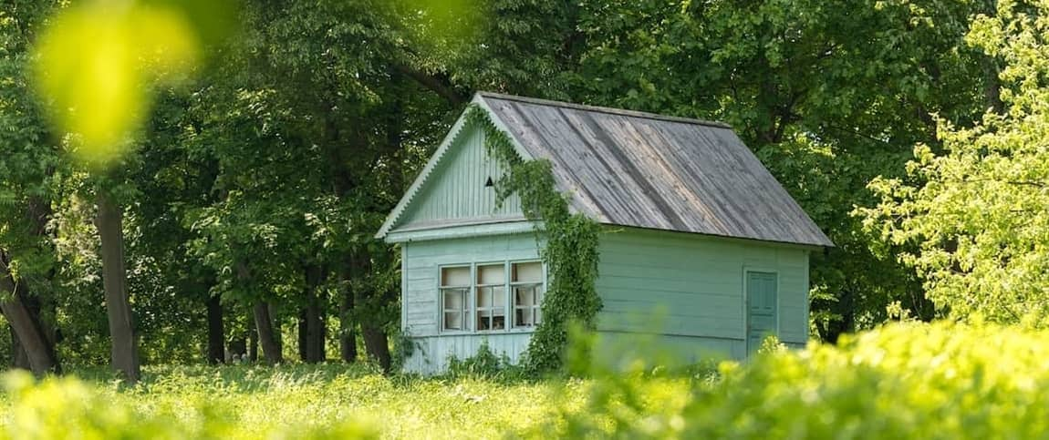 Teal tiny house, depicting a small-sized residential structure in a teal color scheme.