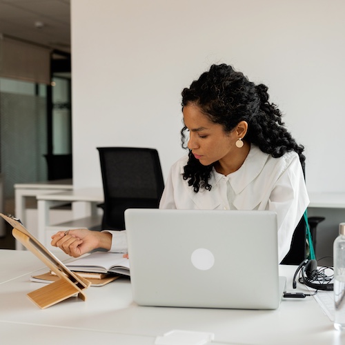 Business woman working on laptop.