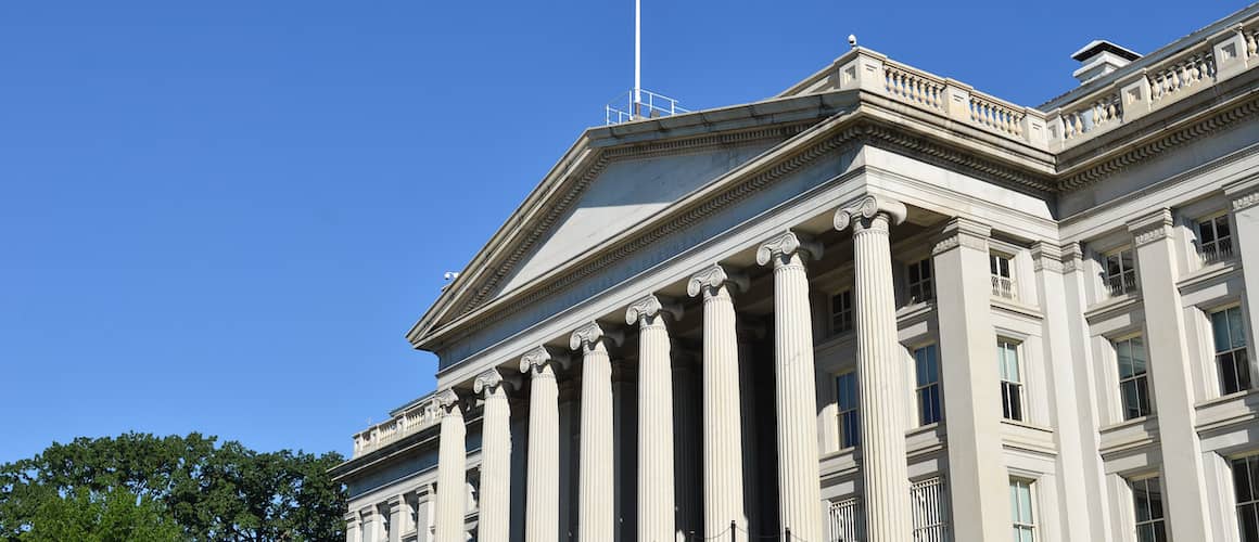 The Federal Reserve building, representing a financial institution.