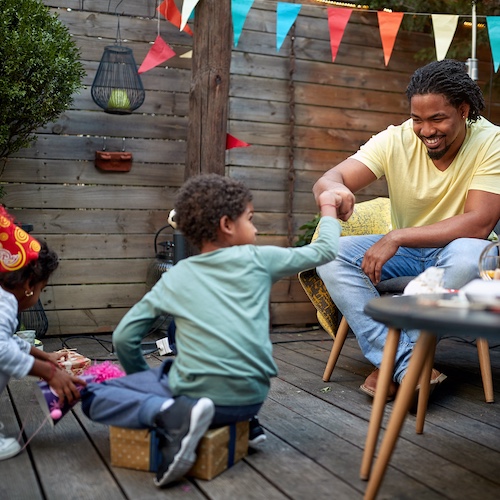 Family celebrating in backyard.