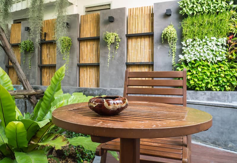 RHB Assets From IGX: Beautiful outdoor patio area with potted plants and cozy seating arrangement.