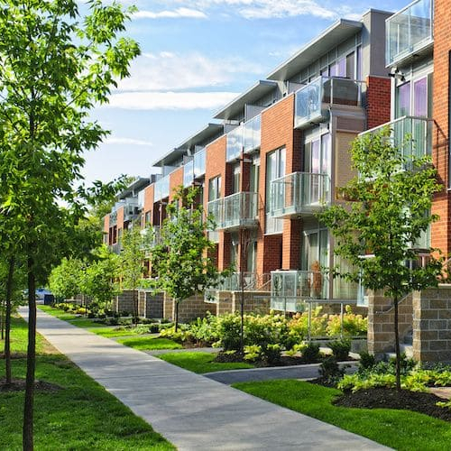 Row of upscale condos, showcasing modern residential buildings or properties.