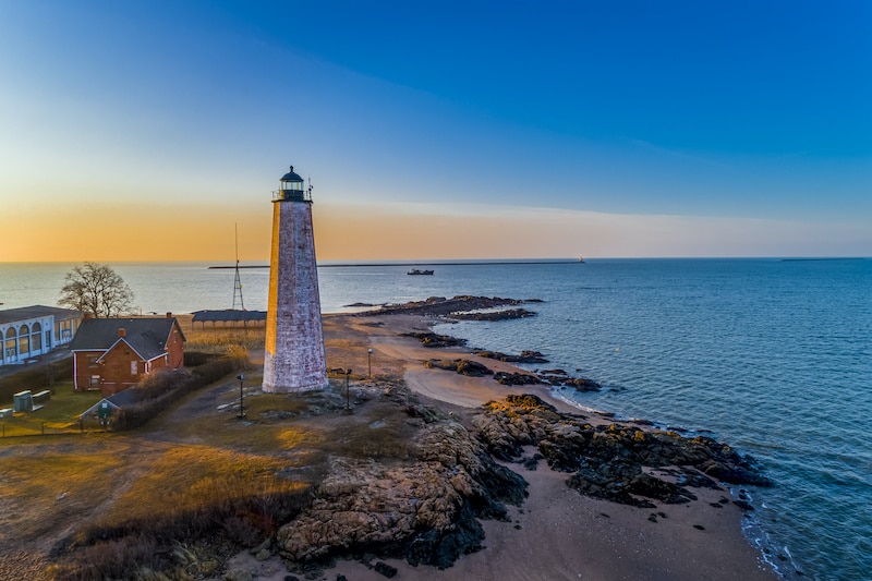 RHB Assets From IGX: Oyster boat at sunrise on New Haven Harbor, Connecticut.