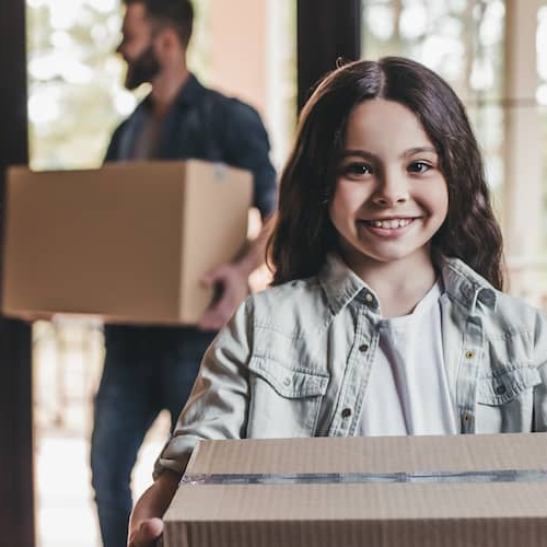 A family actively involved in moving into a new home.