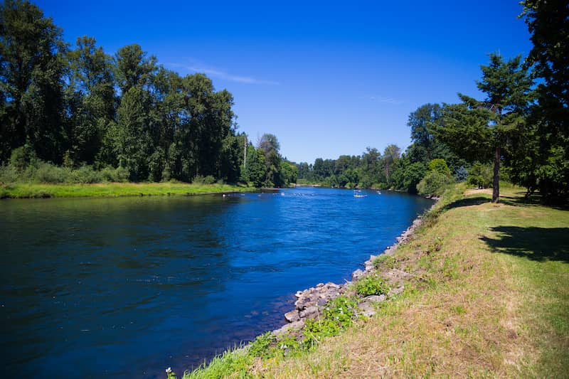 RHB Assets From IGX: Springfield, Oregon river view with lush greenery and blue skies.