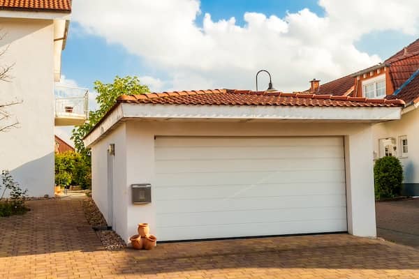 Detached garage with orange tile roof in the Southwest.