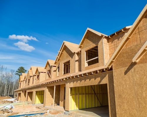 Row of townhouses in the process of being built.