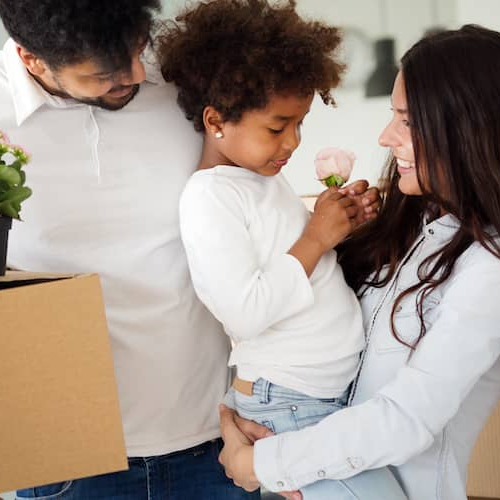 A family in the process of moving, possibly packing belongings or transitioning to a new home.