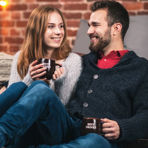 A young cozy couple enjoying a comfortable and intimate moment together.