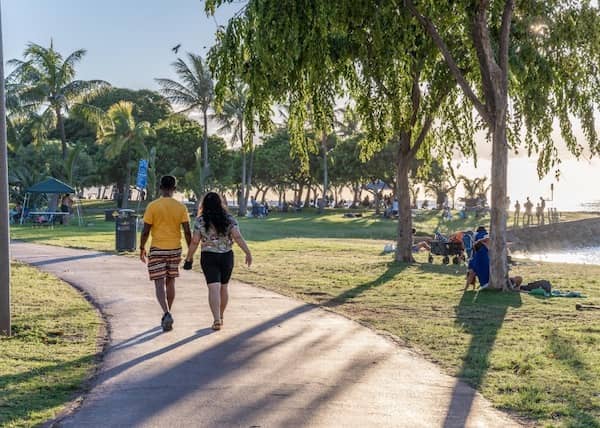 People enjoy a relaxing day at Ala Moana Beach Park. 