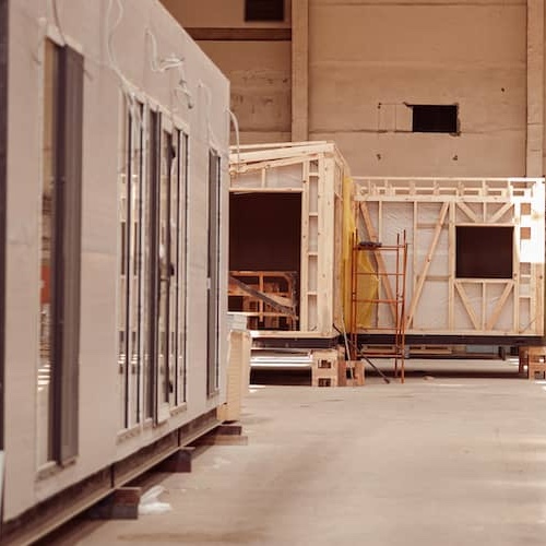 Prefabiricated kit homes in a factory.