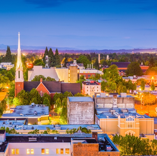 Cityscape of Salem, Oregon lit up with lights.