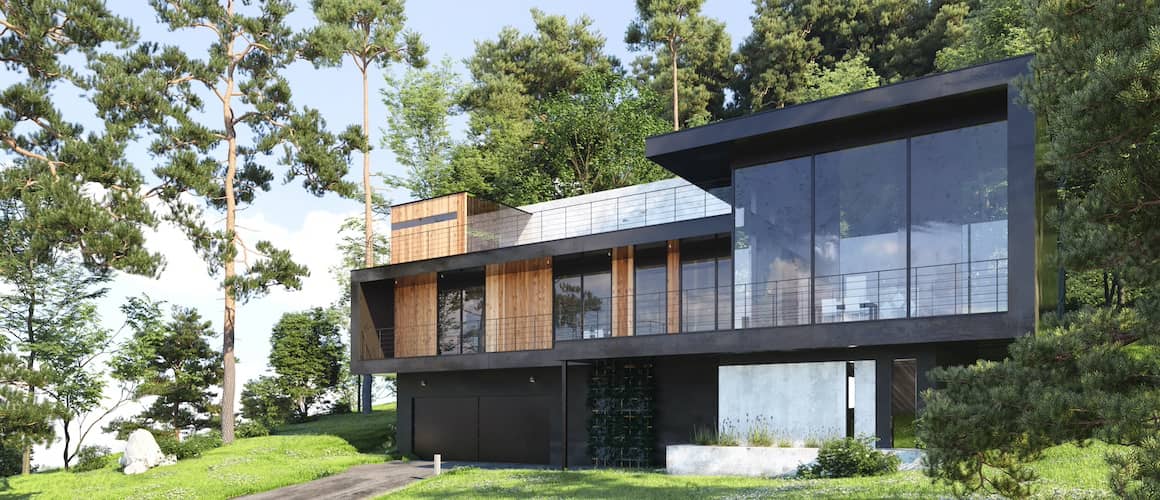 Modern home in wooded lot featuring picture windows.