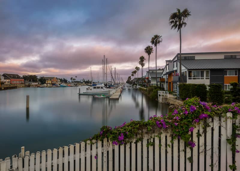 RHB Assets From IGX: Oxnard, California coastal cityscape with a harbor and palm trees.