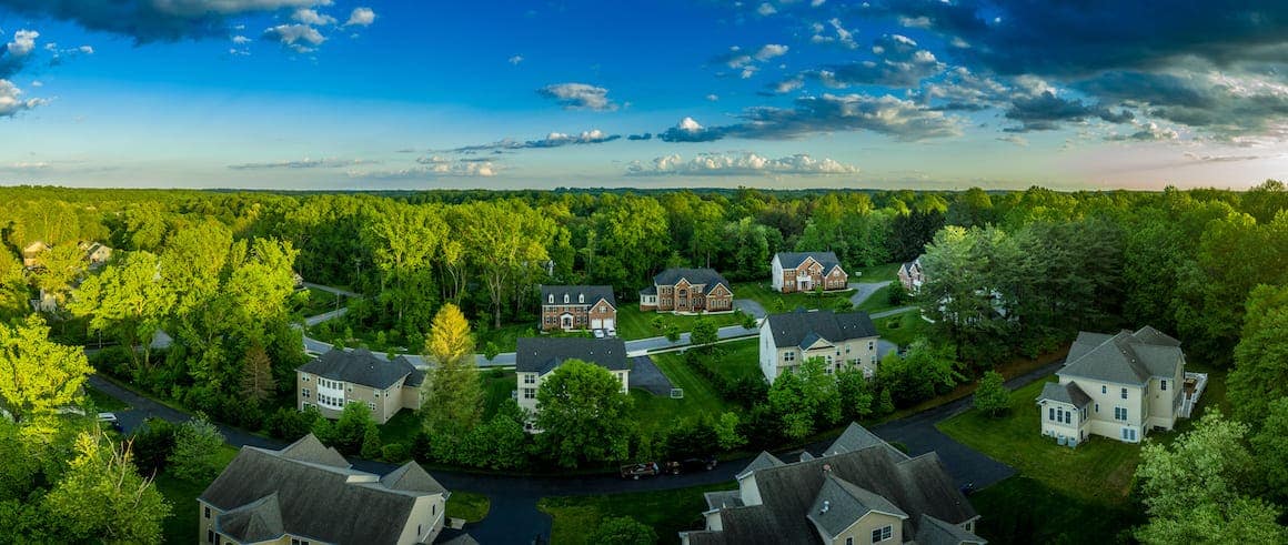 Two homes depicted in an image, potentially representing residential properties or a housing comparison.