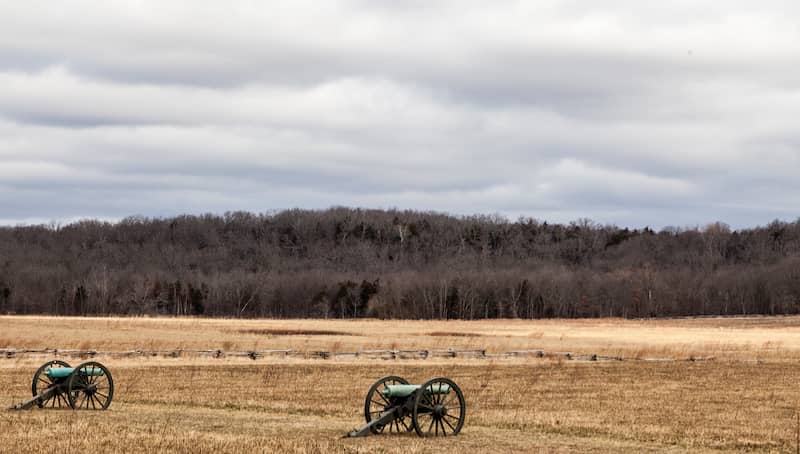 RHB Assets From IGX: Pea Ridge Battlefield monument with a cannon and flags in Arkansas.