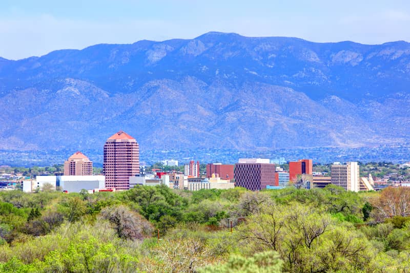 RHB Assets From IGX: Albuquerque, New Mexico cityscape with a mountainous backdrop.