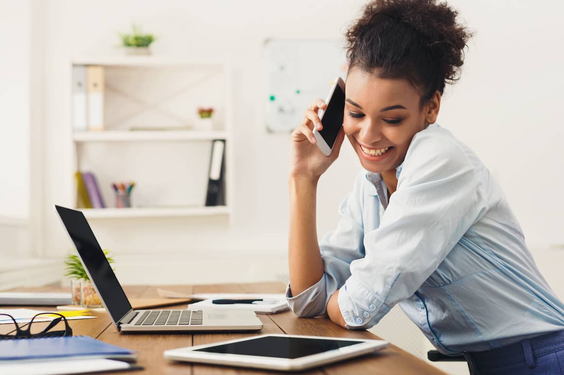 RHB Assets From IGX: Woman on phone in a home office setting