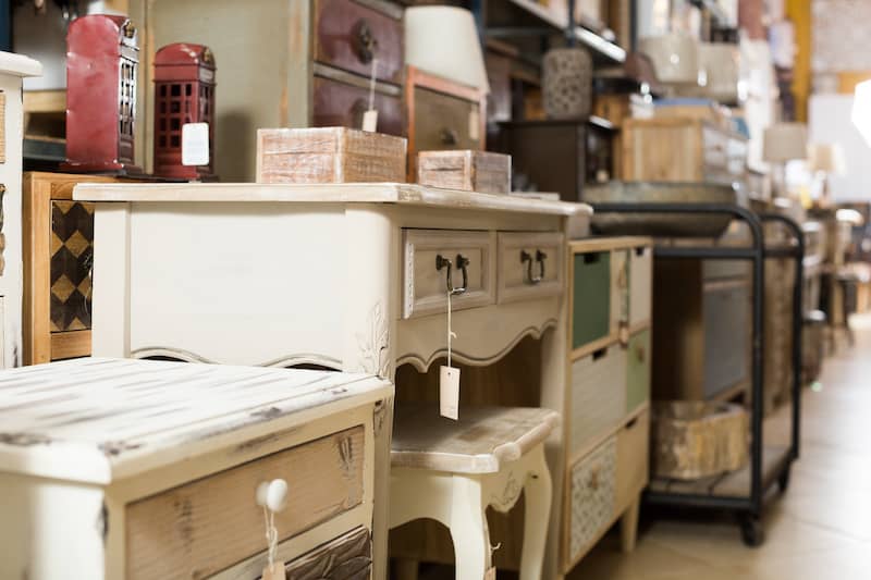 Row of antique furniture and fixtures in a store.