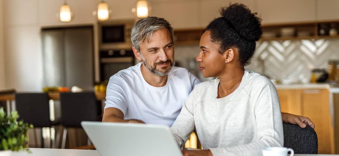 Couple on computer together.