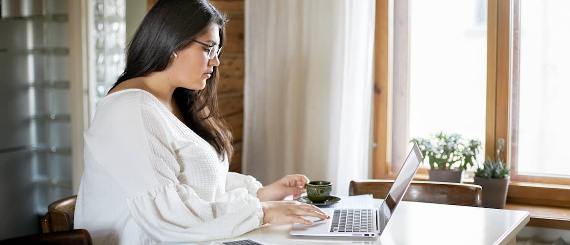 RHB Assets From IGX: Woman working on a laptop in a cozy office