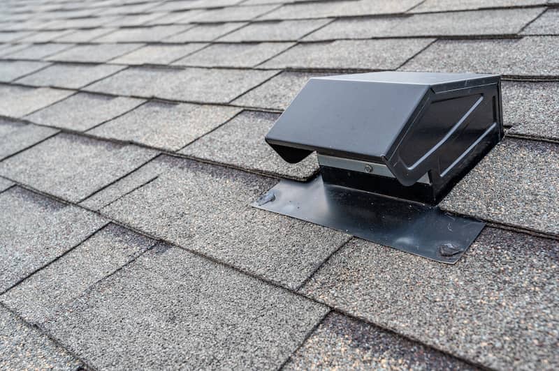 RHB Assets From IGX: Rooftop static vent on a house to improve attic ventilation.