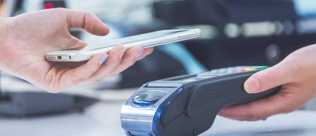 Man paying with phone app.