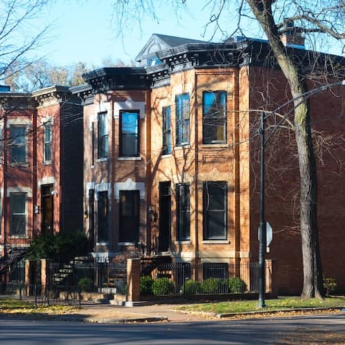 Historic row of two story brick townhomes.